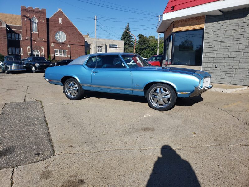 Blue classic car outside Lansing Car Care Center