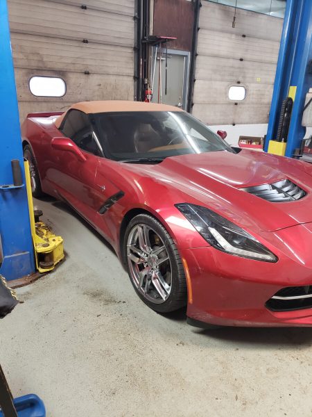Red Corvette inside Lansing Car Care Center